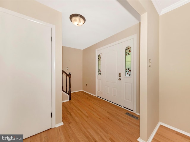 24129 Pecan Grove Ln, Gaithersburg, MD 20882 - entrance foyer featuring light wood-style floors, ornamental molding, and stairway