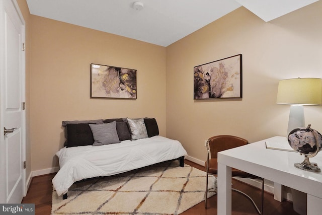 1025 1st St SE Unit 809, Washington, DC 20003 - bedroom with baseboards and wood finished floors