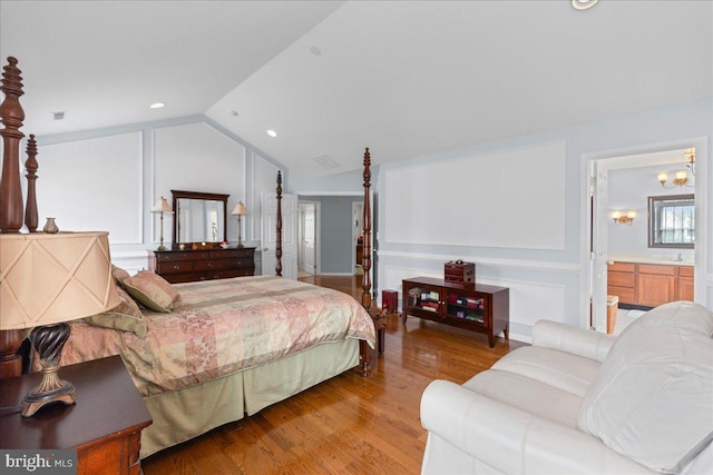 102 Windsor, Swedesboro, NJ 08085 - bedroom with light wood-type flooring, lofted ceiling, and connected bathroom