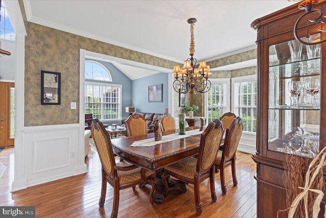 102 Windsor, Swedesboro, NJ 08085 - dining space featuring a chandelier, wood-type flooring, wainscoting, wallpapered walls, and lofted ceiling