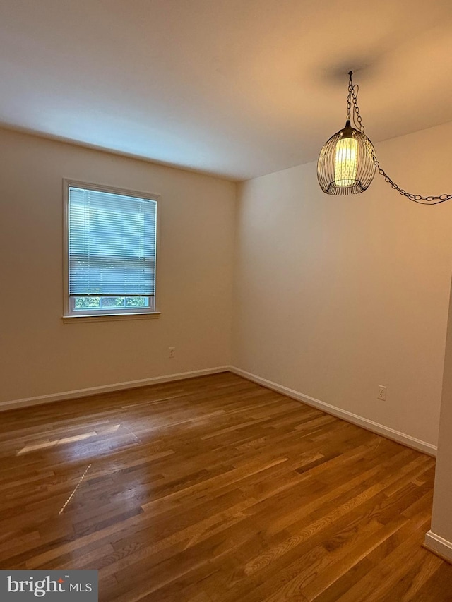 12130 Ambleside Dr, Potomac, MD 20854 - spare room featuring wood finished floors and baseboards