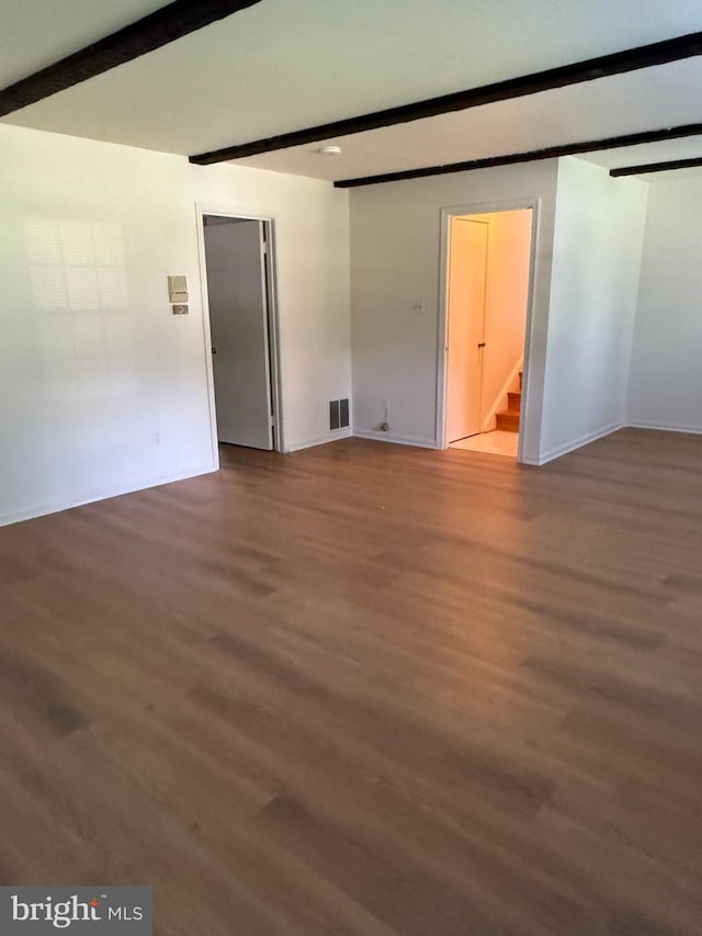 12130 Ambleside Dr, Potomac, MD 20854 - unfurnished room featuring beamed ceiling, wood finished floors, and stairway
