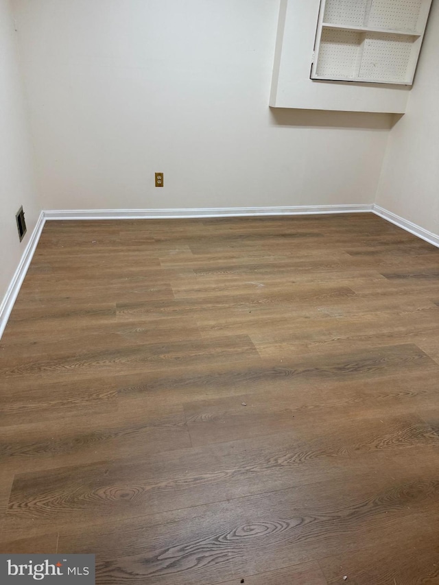 12130 Ambleside Dr, Potomac, MD 20854 - spare room featuring baseboards and dark wood-style floors