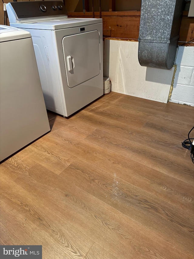12130 Ambleside Dr, Potomac, MD 20854 - laundry room with independent washer and dryer and light wood-type flooring