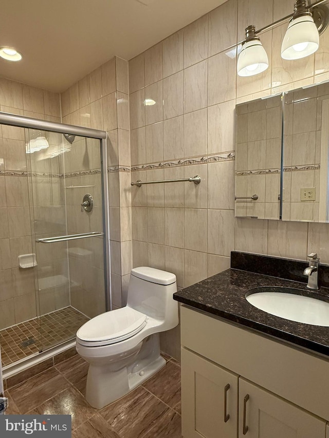 12130 Ambleside Dr, Potomac, MD 20854 - full bath with vanity, a stall shower, tile walls, and tile patterned floors