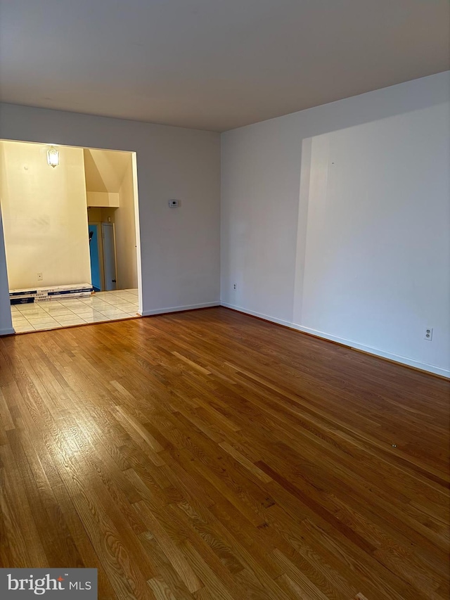 12130 Ambleside Dr, Potomac, MD 20854 - spare room featuring wood finished floors and baseboards