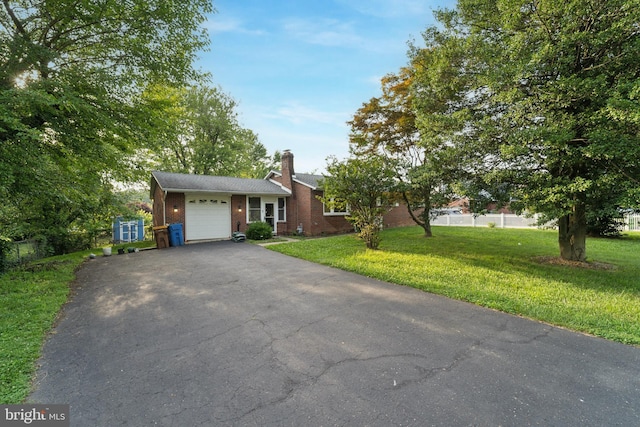 4030 Bensalem Blvd, Bensalem, PA 19020 - view of front of home with driveway, a garage, a chimney, and brick siding