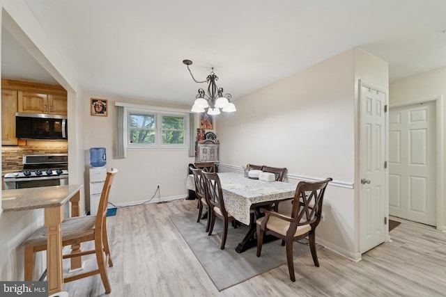 4030 Bensalem Blvd, Bensalem, PA 19020 - dining area with light wood-style flooring and a chandelier