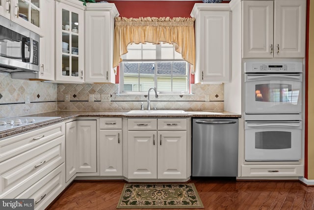 945 Hamilton Way, Warwick, PA 18974 - kitchen featuring appliances with stainless steel finishes, white cabinets, glass insert cabinets, and dark wood-type flooring