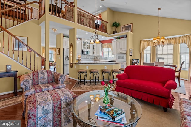 945 Hamilton Way, Warwick, PA 18974 - living room featuring a chandelier, stairway, high vaulted ceiling, wood finished floors, and recessed lighting