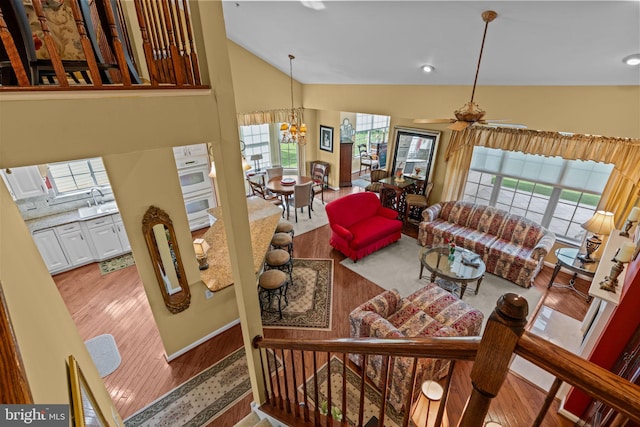 945 Hamilton Way, Warwick, PA 18974 - living room featuring wood finished floors, a chandelier, ceiling fan, and high vaulted ceiling