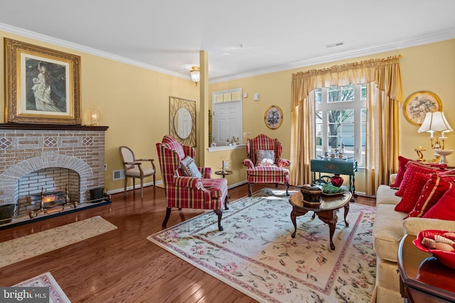 945 Hamilton Way, Warwick, PA 18974 - living area with crown molding, wood finished floors, and a brick fireplace