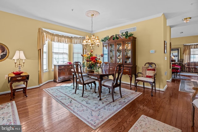 945 Hamilton Way, Warwick, PA 18974 - dining space with wood finished floors, a chandelier, and crown molding