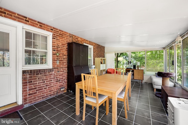 808 Olmstead Rd, Baltimore, MD 21208 - sunroom with brick wall and tile patterned floors