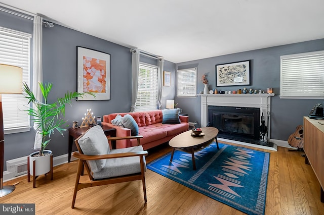808 Olmstead Rd, Baltimore, MD 21208 - living room with a glass covered fireplace and wood finished floors