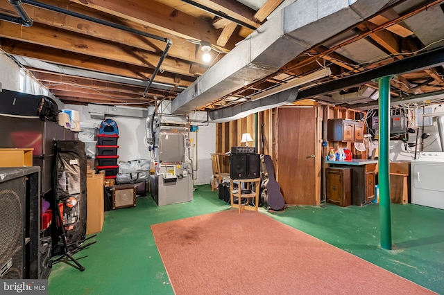 808 Olmstead Rd, Baltimore, MD 21208 - unfinished basement featuring washer and dryer and heating unit