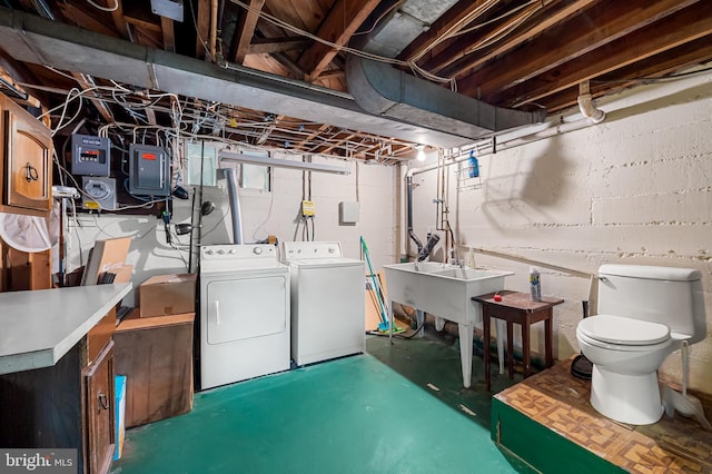 808 Olmstead Rd, Baltimore, MD 21208 - unfinished below grade area featuring a sink and washer and clothes dryer
