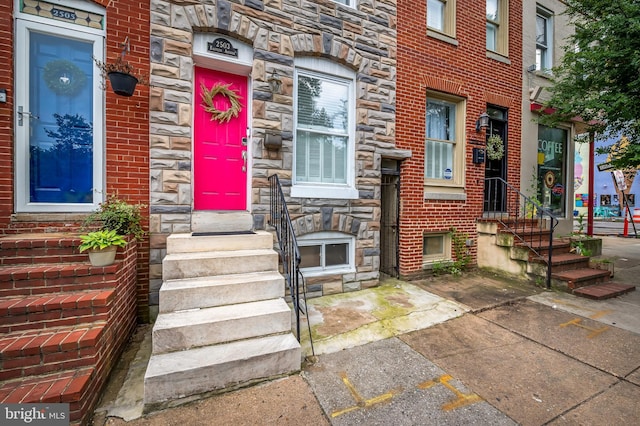 2503 Eastern Ave, Baltimore, MD 21224 - property entrance with stone siding and uncovered parking