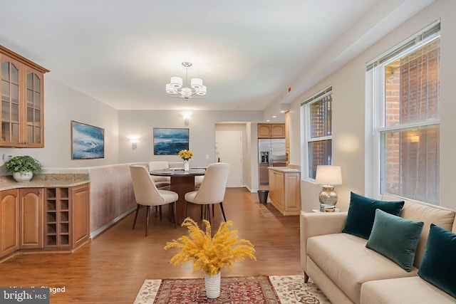 1458 Columbia Rd NW Unit 109, Washington, DC 20009 - dining space featuring a chandelier and light wood-style flooring