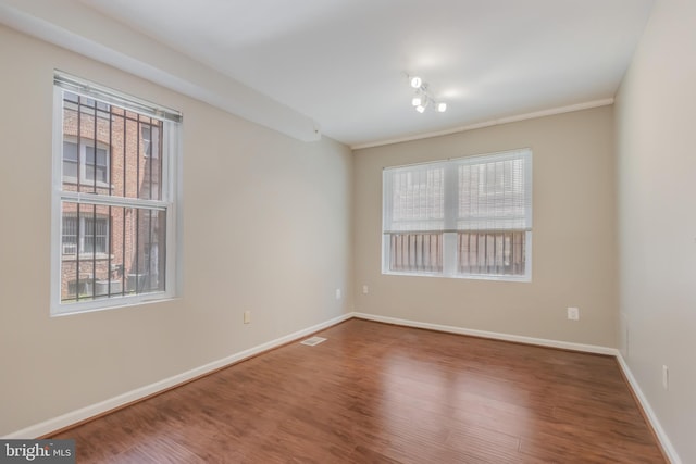 1458 Columbia Rd NW Unit 109, Washington, DC 20009 - empty room featuring healthy amount of natural light and wood finished floors