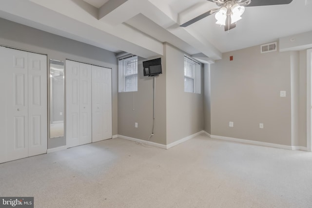 1458 Columbia Rd NW Unit 109, Washington, DC 20009 - unfurnished bedroom featuring two closets, carpet flooring, and a ceiling fan