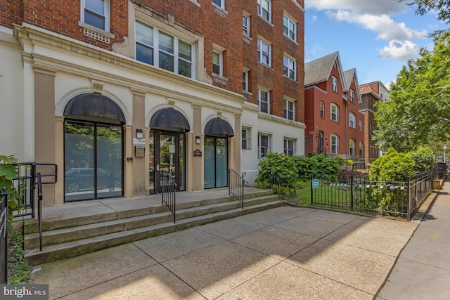 1458 Columbia Rd NW Unit 109, Washington, DC 20009 - view of exterior entry featuring brick siding and a residential view