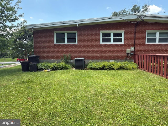 1233 Knightswood Rd, Baltimore, MD 21239 - view of home's exterior featuring a yard and brick siding