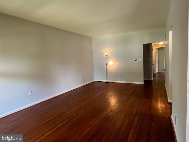 1233 Knightswood Rd, Baltimore, MD 21239 - empty room featuring dark wood finished floors and baseboards