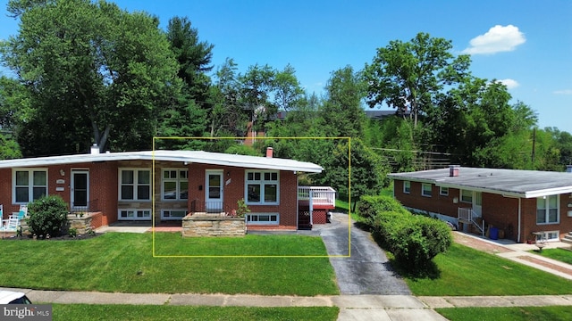 1233 Knightswood Rd, Baltimore, MD 21239 - single story home with brick siding, a front yard, and driveway