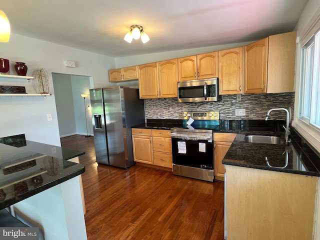 1233 Knightswood Rd, Baltimore, MD 21239 - kitchen with stainless steel appliances, tasteful backsplash, dark wood-style floors, dark stone countertops, and light brown cabinetry
