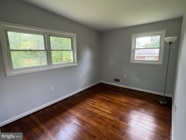 1233 Knightswood Rd, Baltimore, MD 21239 - spare room with wood finished floors and lofted ceiling