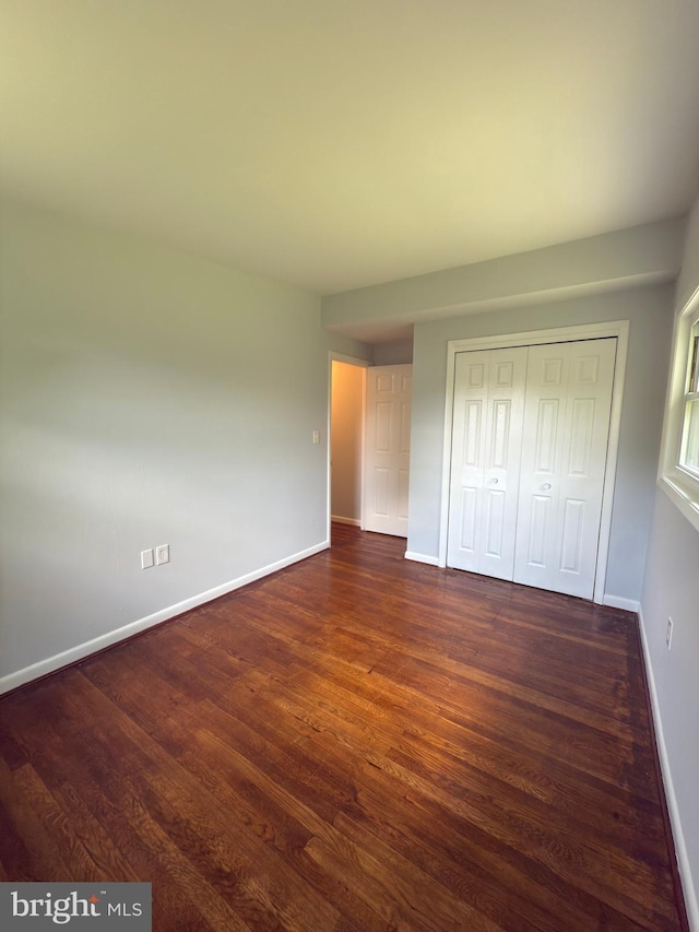 1233 Knightswood Rd, Baltimore, MD 21239 - unfurnished bedroom with wood finished floors and a closet