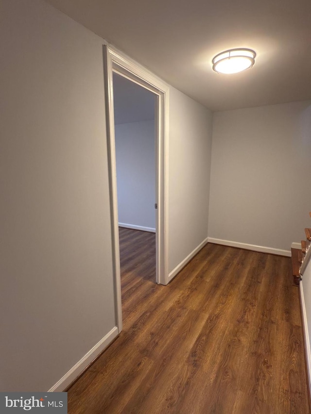 1233 Knightswood Rd, Baltimore, MD 21239 - empty room featuring dark wood-style floors and baseboards