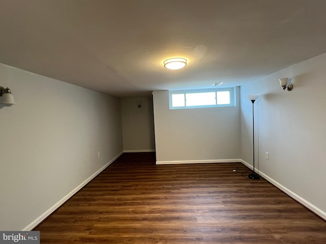 1233 Knightswood Rd, Baltimore, MD 21239 - below grade area with dark wood finished floors and baseboards