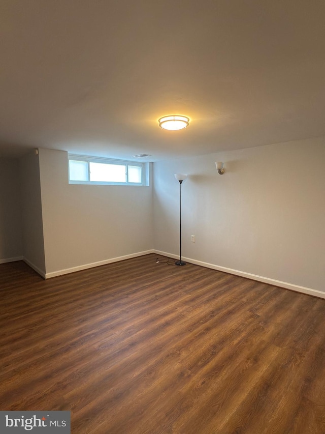 1233 Knightswood Rd, Baltimore, MD 21239 - empty room featuring baseboards and dark wood-style floors