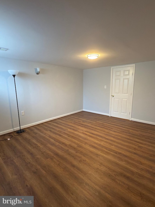 1233 Knightswood Rd, Baltimore, MD 21239 - empty room with dark wood-style flooring and baseboards