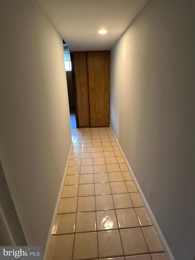 1233 Knightswood Rd, Baltimore, MD 21239 - hallway with light tile patterned floors and baseboards