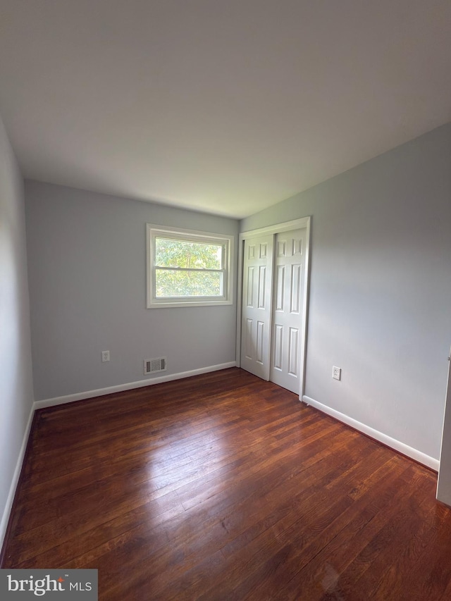 1233 Knightswood Rd, Baltimore, MD 21239 - unfurnished bedroom featuring wood finished floors and a closet