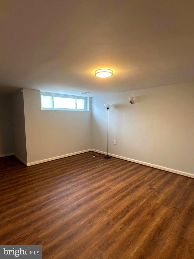 1233 Knightswood Rd, Baltimore, MD 21239 - spare room featuring baseboards and dark wood-style floors