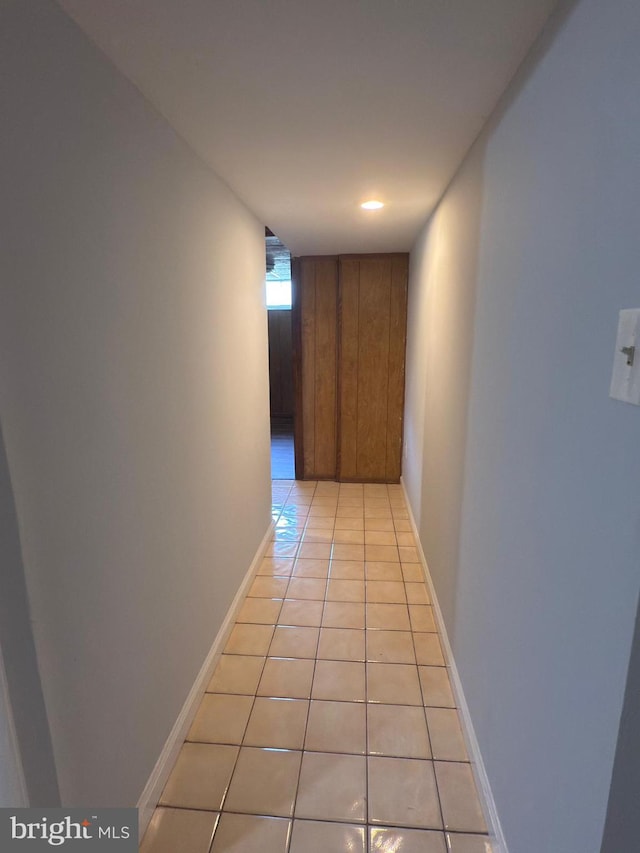1233 Knightswood Rd, Baltimore, MD 21239 - corridor with light tile patterned floors and baseboards
