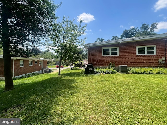1233 Knightswood Rd, Baltimore, MD 21239 - view of side of home featuring a lawn and brick siding