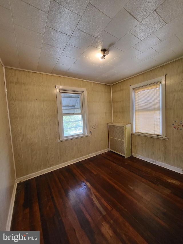 542 S 14 1/2 St, Reading, PA 19602 - unfurnished room featuring hardwood / wood-style floors and wooden walls