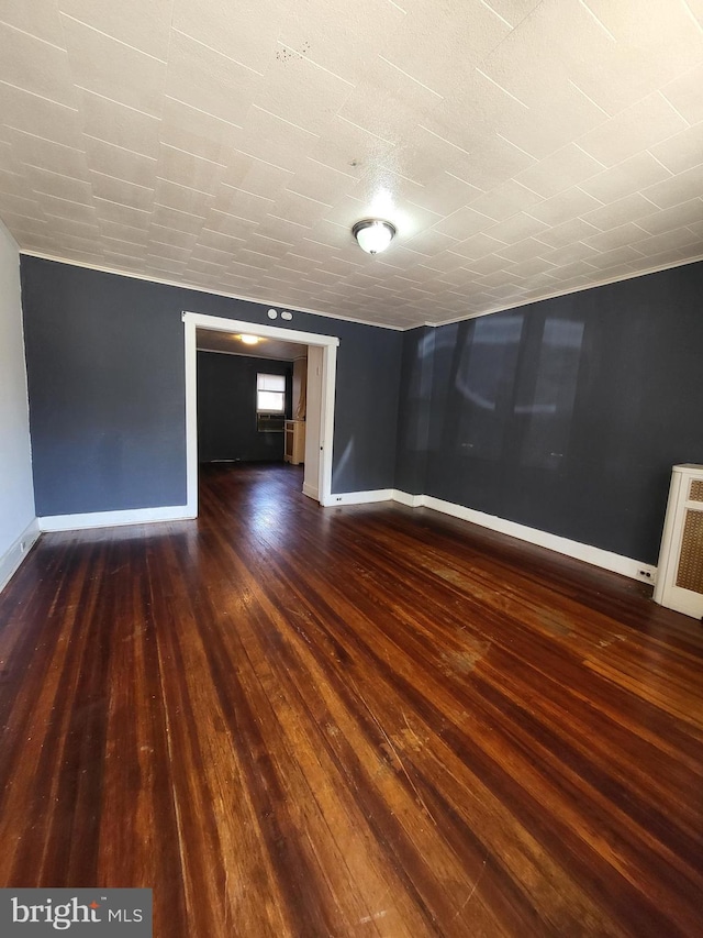 542 S 14 1/2 St, Reading, PA 19602 - empty room featuring dark wood-style floors and baseboards