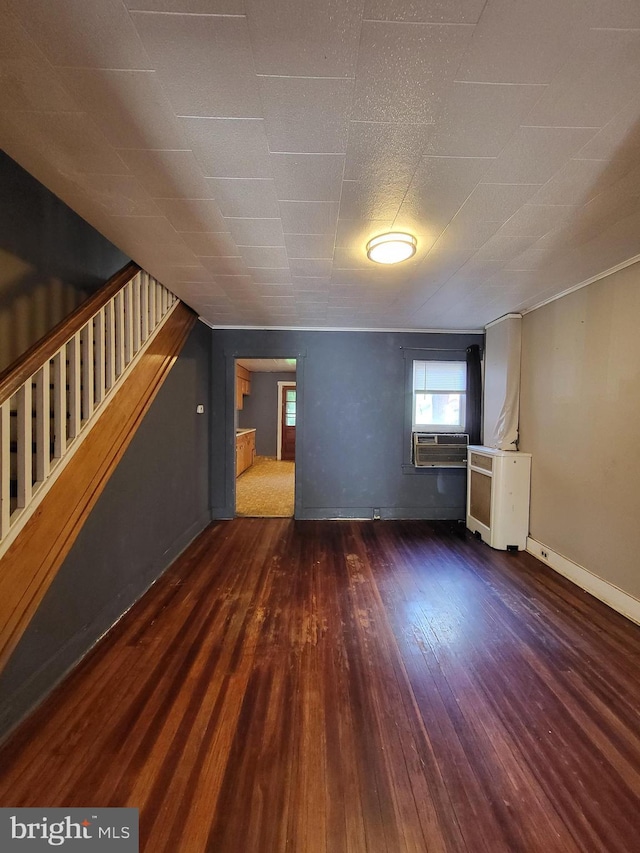 542 S 14 1/2 St, Reading, PA 19602 - unfurnished living room featuring wood-type flooring, stairs, and cooling unit