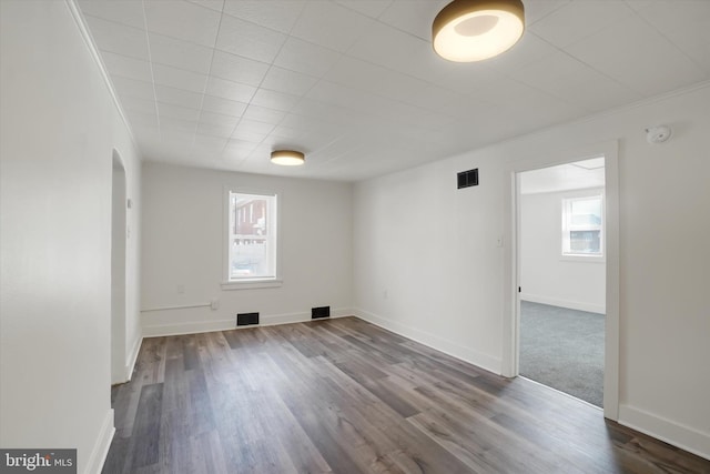 1221 W Heiges St, York, PA 17404 - unfurnished room with arched walkways, a smoke detector, and dark wood-style floors