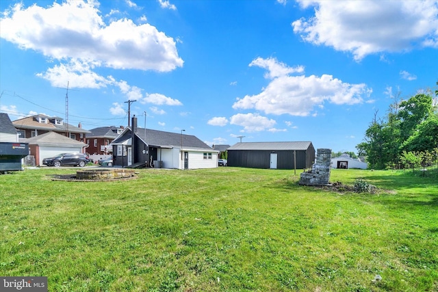 1221 W Heiges St, York, PA 17404 - back of house with a yard and an outbuilding