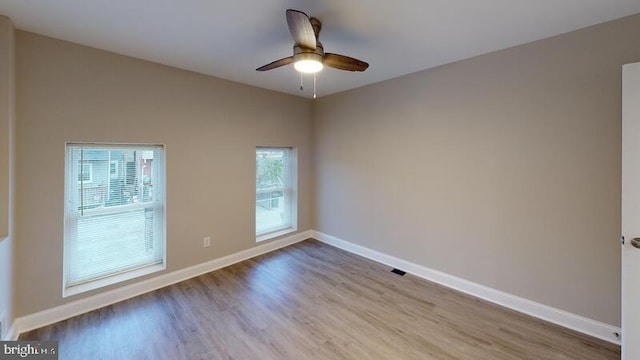 224 N Rose St, Baltimore, MD 21224 - spare room with wood finished floors and a ceiling fan