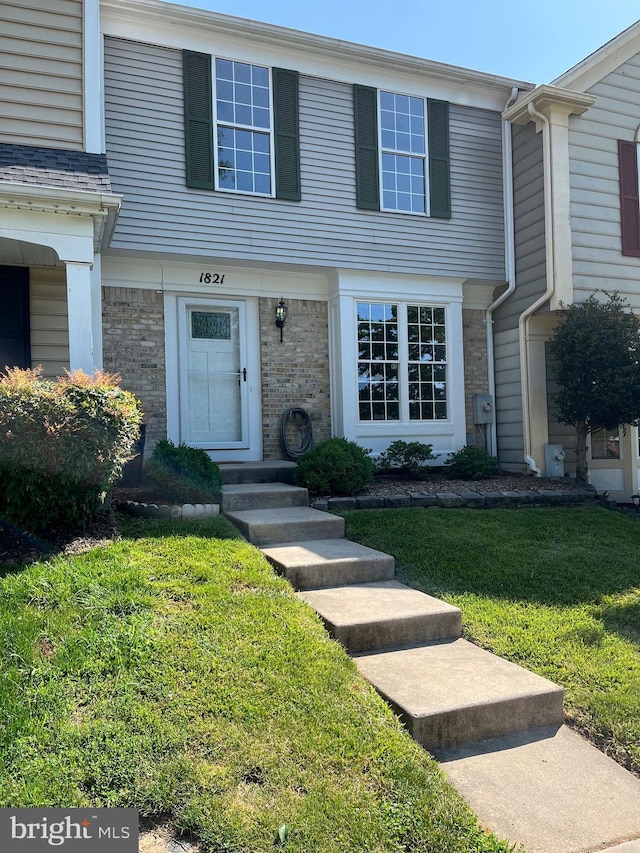 1821 Oxford Sq, Bel Air, MD 21015 - townhome / multi-family property featuring a front yard and brick siding