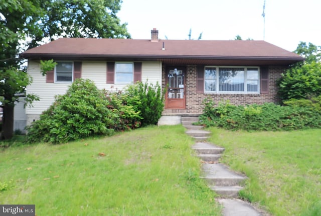701 Tamarack Trl, Reading, PA 19607 - single story home with a front lawn, brick siding, and a chimney