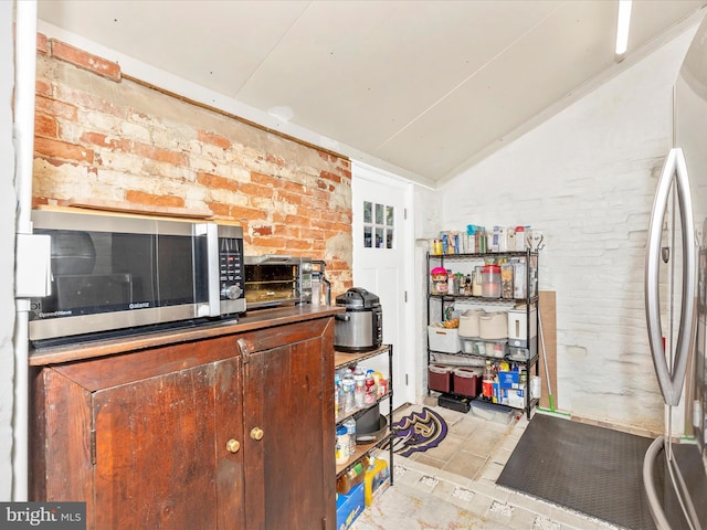 23 W 5th St, Frederick, MD 21701 - interior space with brick wall and vaulted ceiling